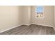 Neutral bedroom with plank flooring, natural light and space at 8323 Enclave Way # 104, Sarasota, FL 34243