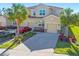 Beautiful exterior showcasing the home's facade, two-car garage, and well-manicured landscaping at 8323 Enclave Way # 104, Sarasota, FL 34243