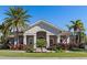Beautiful home with stucco exterior, lush landscaping, and a well-maintained front yard at 8323 Enclave Way # 104, Sarasota, FL 34243