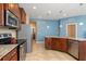 Spacious kitchen features stainless steel appliances, tile floor, and eat in area at 8323 Enclave Way # 104, Sarasota, FL 34243