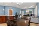 Open floor plan connects the dining room to the kitchen and living area at 8323 Enclave Way # 104, Sarasota, FL 34243