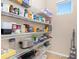 Walk-in pantry features lots of storage shelves and is well organized at 8323 Enclave Way # 104, Sarasota, FL 34243