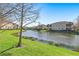 Scenic backyard pond view, ideal for relaxation and enjoying nature's tranquility at 8323 Enclave Way # 104, Sarasota, FL 34243