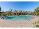 Community pool surrounded by a brick deck and palm trees, offering a refreshing oasis for residents and their guests at 8323 Enclave Way # 104, Sarasota, FL 34243