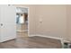 Versatile room featuring plank flooring and an open view of the kitchen at 8323 Enclave Way # 104, Sarasota, FL 34243