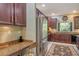 Lovely kitchen with granite countertops, stainless steel appliances, dark wood cabinetry, and natural lighting at 6156 41St E St, Bradenton, FL 34203