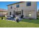 Large backyard with patio and cozy seating area, perfect for relaxation and entertaining at 10905 Copperlefe Dr, Bradenton, FL 34212