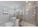 This bathroom features a large tub, a separate shower, and large windows for natural light at 10905 Copperlefe Dr, Bradenton, FL 34212