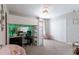 A well lit bedroom with a desk beneath the loft bed and a fluffy chair in a charming space at 10905 Copperlefe Dr, Bradenton, FL 34212
