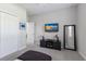 Bright bedroom with a TV, mirror, closet and neutral tones creating a relaxing atmosphere at 10905 Copperlefe Dr, Bradenton, FL 34212