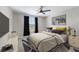 A well lit bedroom with a large bed, stylish rug, neutral walls, and modern decor create a relaxing ambiance at 10905 Copperlefe Dr, Bradenton, FL 34212