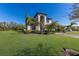 Attractive two-story home with a green lawn and a paver driveway at 10905 Copperlefe Dr, Bradenton, FL 34212