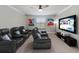 A home theater featuring reclining seats, movie posters and a large screen TV for entertainment at 10905 Copperlefe Dr, Bradenton, FL 34212