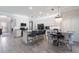 Open kitchen and dining area with stainless steel appliances and a breakfast bar at 10905 Copperlefe Dr, Bradenton, FL 34212