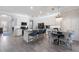 Spacious kitchen with white cabinets, granite countertops, stainless steel appliances, and an eat-in island at 10905 Copperlefe Dr, Bradenton, FL 34212