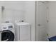 Efficient laundry room featuring a modern washer and dryer setup at 10905 Copperlefe Dr, Bradenton, FL 34212