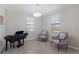Bright living area featuring tiled floors, natural light, and a piano at 10905 Copperlefe Dr, Bradenton, FL 34212