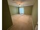 Green bedroom featuring tan carpet, a ceiling fan, and curtains for natural light control at 11120 Sailbrooke Dr, Riverview, FL 33579