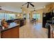 Spacious eat-in kitchen featuring tile flooring, wood cabinetry, modern appliances, and a sunny breakfast nook at 1160 Mill Creek Rd, Bradenton, FL 34212