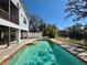 Elevated in-ground pool next to a canal offering a great space for relaxing outdoors at 1160 Mill Creek Rd, Bradenton, FL 34212