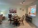 Dining area features a round table, seating, and a view of the kitchen at 1257 S Portofino Dr # 208, Sarasota, FL 34242