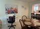 Cozy dining area and workspace with view of the kitchen at 1257 S Portofino Dr # 208, Sarasota, FL 34242