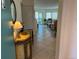 Inviting entryway features tile floors and a glimpse into the sunny living area and lanai at 1257 S Portofino Dr # 208, Sarasota, FL 34242