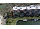 Aerial view of the condo community featuring a waterfront setting and private boat slips at 1257 S Portofino Dr # 208, Sarasota, FL 34242