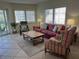 Bright living room featuring stylish furniture, large windows, and a view of the outdoors at 1257 S Portofino Dr # 208, Sarasota, FL 34242