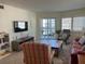 Cozy living room with comfortable seating and access to the screened-in lanai at 1257 S Portofino Dr # 208, Sarasota, FL 34242