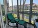 Screened-in patio seating area overlooking the marina with beautiful views at 1257 S Portofino Dr # 208, Sarasota, FL 34242