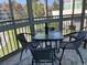 Relaxing enclosed patio offers a cozy space for dining with a table, chairs, and serene outdoor views at 1257 S Portofino Dr # 208, Sarasota, FL 34242