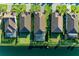 Overhead view of backyard oasis, screened lanai, and beautiful landscaping bordering a tranquil lake at 13228 Saw Palm Creek Trl, Lakewood Ranch, FL 34211