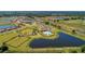 Panoramic aerial view of the community showcasing the neighborhood layout, lakes, clubhouse, and surrounding landscape at 13228 Saw Palm Creek Trl, Lakewood Ranch, FL 34211