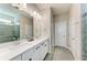 Modern bathroom features a double vanity, sleek fixtures, and a glass-enclosed shower at 13228 Saw Palm Creek Trl, Lakewood Ranch, FL 34211