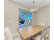 Dining area with a view of the outdoor grill and screened in pool area at 13228 Saw Palm Creek Trl, Lakewood Ranch, FL 34211