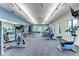 Well-equipped fitness center with modern machines, large windows, and ample space for a complete workout at 13228 Saw Palm Creek Trl, Lakewood Ranch, FL 34211