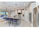 Modern kitchen featuring a large island, stainless steel appliances, and ample cabinet space at 13228 Saw Palm Creek Trl, Lakewood Ranch, FL 34211