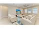 Bright living room featuring neutral tones, modern furniture, and an open layout perfect for entertaining at 13228 Saw Palm Creek Trl, Lakewood Ranch, FL 34211