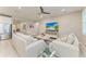 Open-concept living area with stainless steel appliances, eat-in kitchen, sleek ceiling fan, and ample natural light at 13228 Saw Palm Creek Trl, Lakewood Ranch, FL 34211