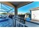 Outdoor kitchen boasts built-in stainless grill, granite counters, and water views from the screened lanai at 13228 Saw Palm Creek Trl, Lakewood Ranch, FL 34211