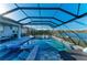 The pool and spa have access to the lanai with an outdoor kitchen and seating area for entertaining at 13228 Saw Palm Creek Trl, Lakewood Ranch, FL 34211