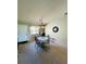 Well-lit dining area with seating for four, complemented by neutral walls and a charming chandelier at 1412 56Th W St # 1412, Bradenton, FL 34209