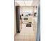 Bright kitchen with white appliances, cabinets, and tile floors, offering a clean aesthetic at 1412 56Th W St # 1412, Bradenton, FL 34209