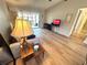 Bright living room with wood flooring, a comfortable sofa, and access to the lanai at 1412 56Th W St # 1412, Bradenton, FL 34209