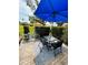 Back patio with outdoor table, chairs, and bicycle at 1412 56Th W St # 1412, Bradenton, FL 34209
