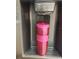 Close up of refrigerator water and ice dispenser with a pink STAR water bottle filling with water at 1412 56Th W St # 1412, Bradenton, FL 34209