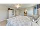 Inviting bedroom featuring a ceiling fan, nautical decor, and a bright atmosphere at 16419 62Nd E Gln, Parrish, FL 34219