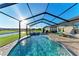 Enjoy this swimming pool with sun shelf, spa and lake view at 16419 62Nd E Gln, Parrish, FL 34219