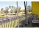 Picturesque screened-in balcony view overlooking a peaceful lake and lush greenery at 2060 Willow Hammock Cir # 201, Punta Gorda, FL 33983